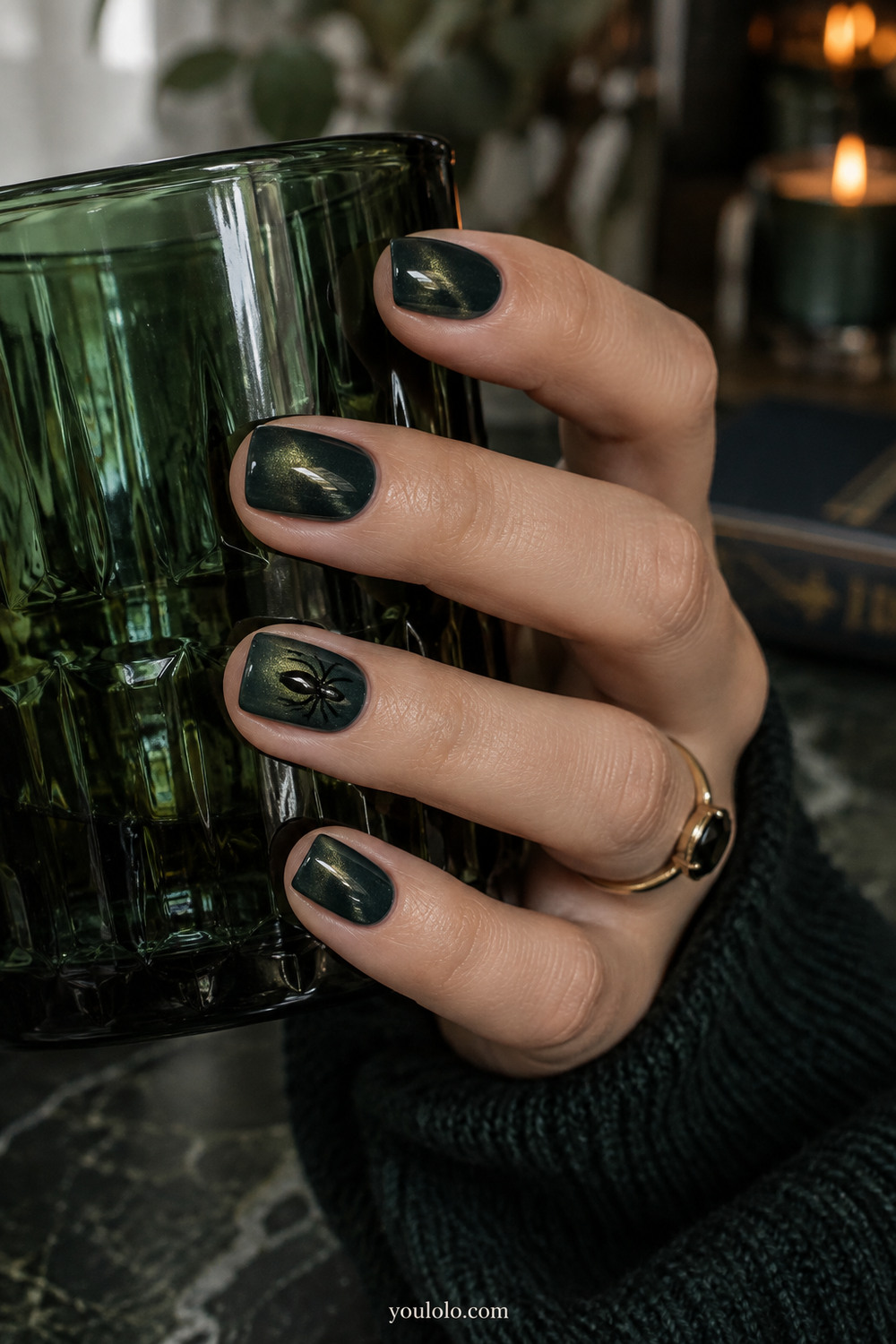 Forest green velvet cat eye nails with a tiny spider accent