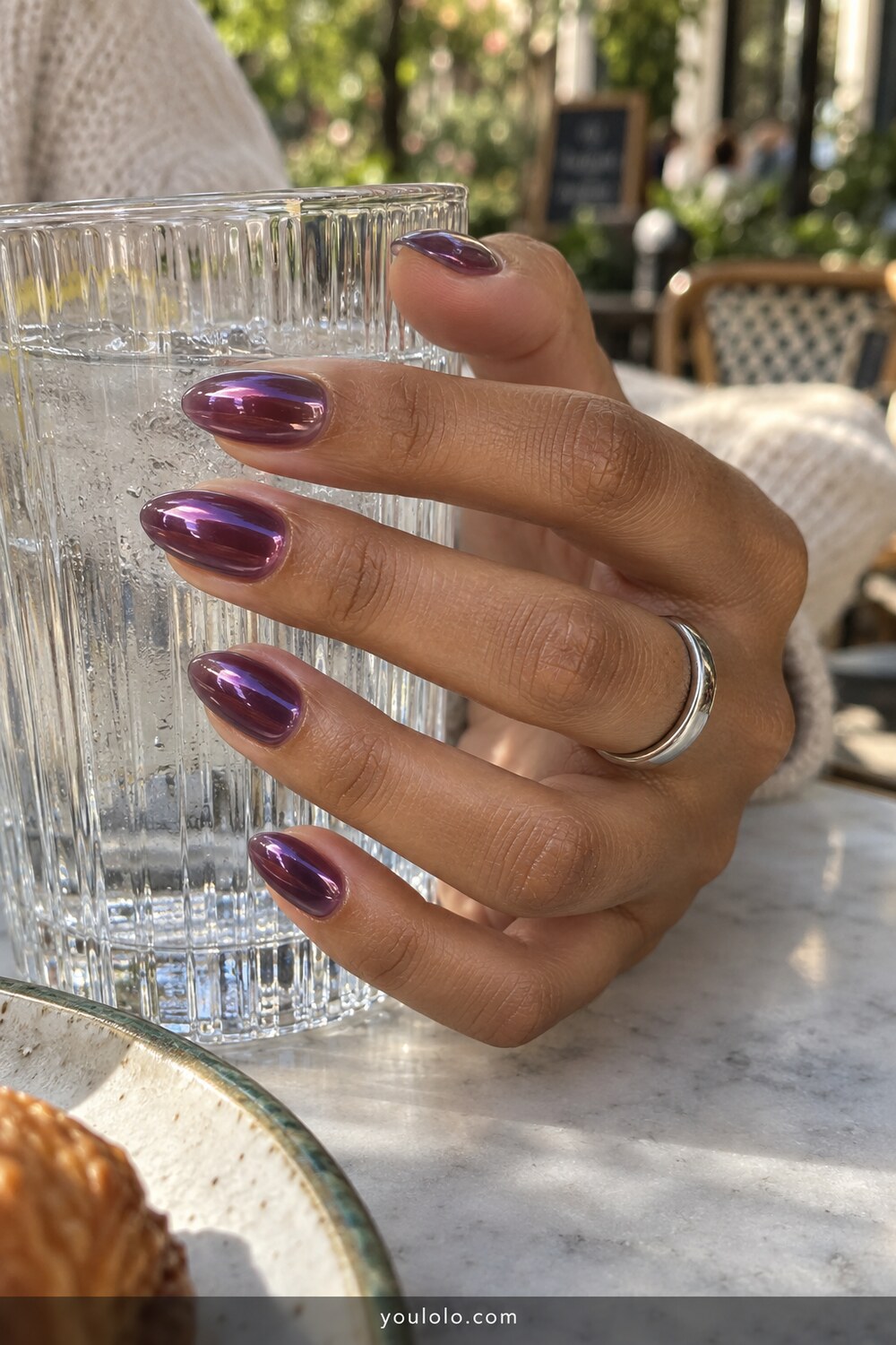 Translucent grape syrup chrome oval nail design
