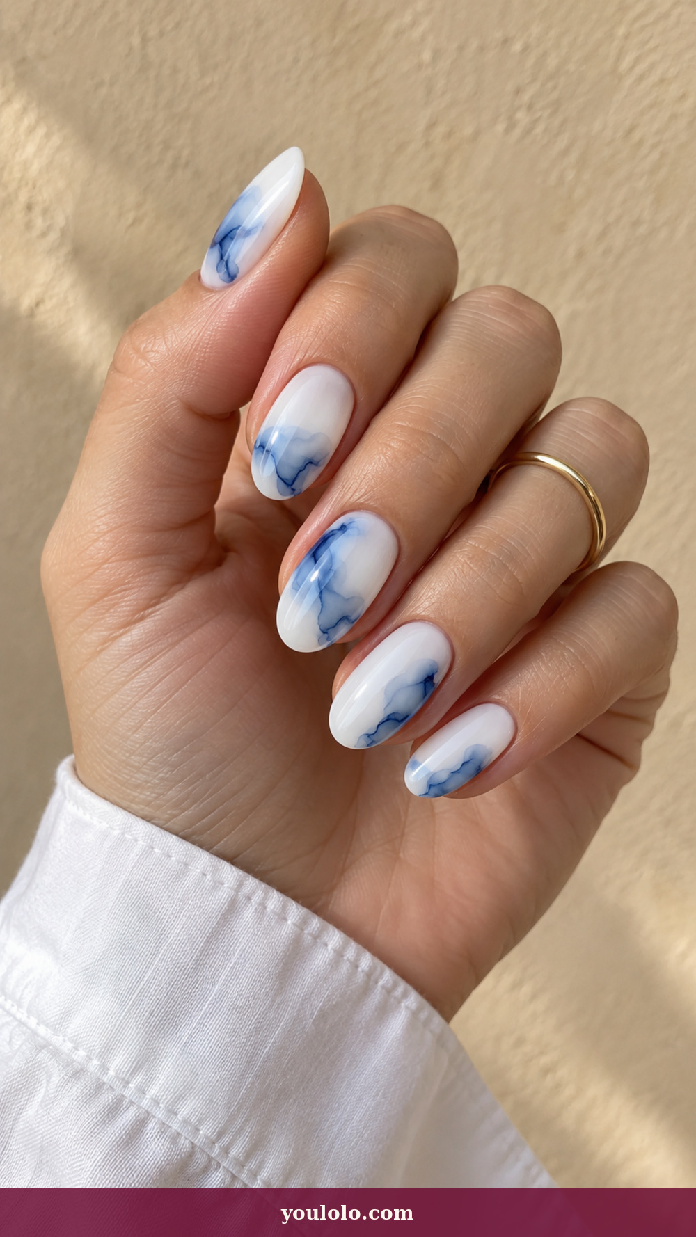 Blue and White Nails idea 8: Icy Ink Bloom on a realistic feminine hand