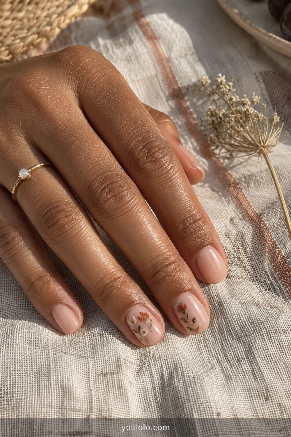 Delicate late summer floral accent nails in muted fall colors