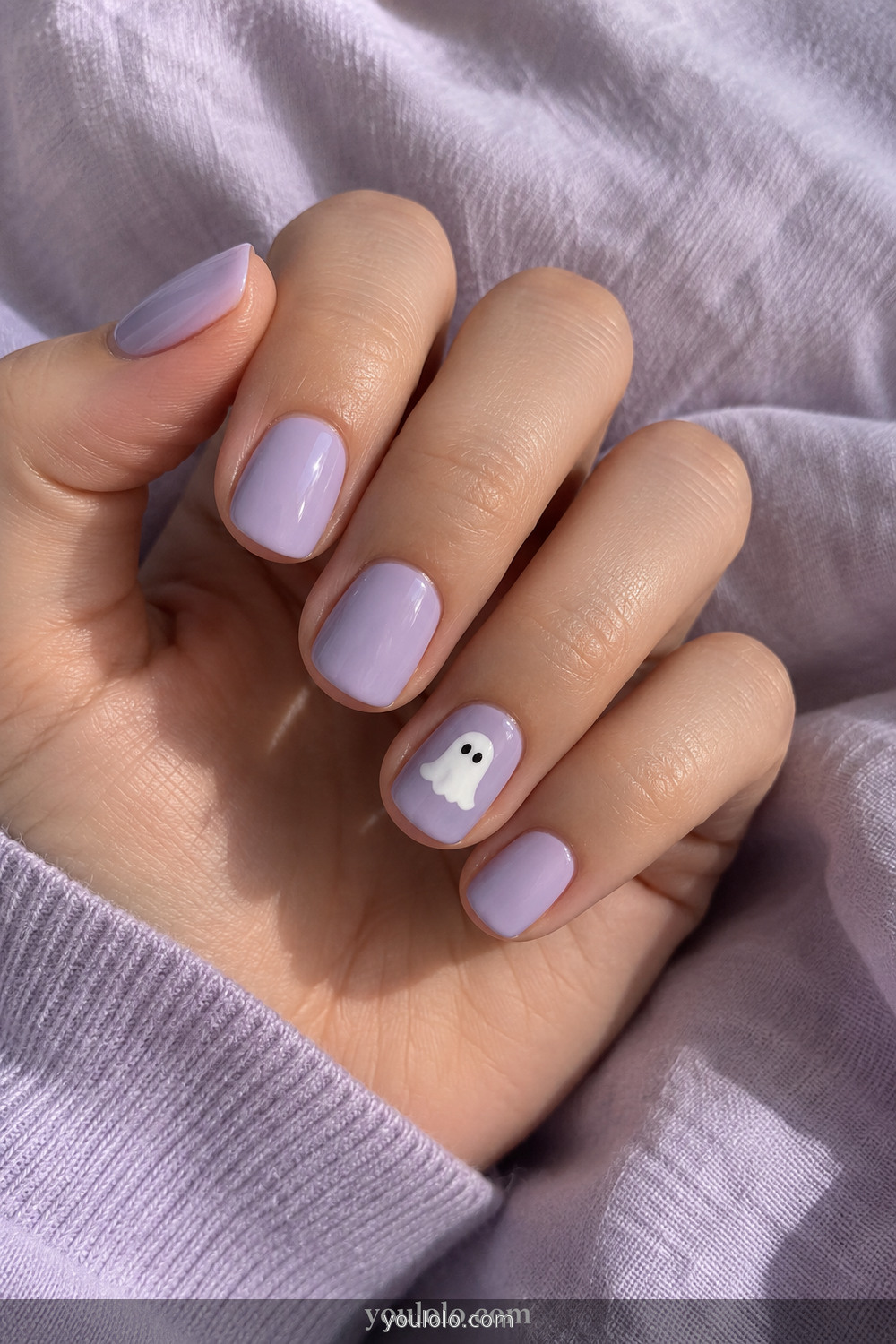 Lavender manicure with one easy white ghost accent