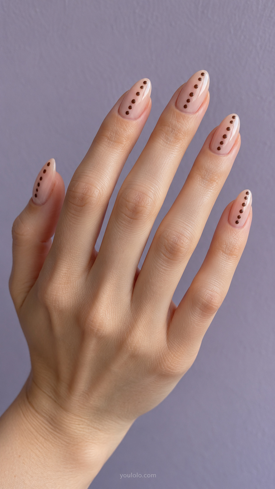 A single row of brown dots manicure