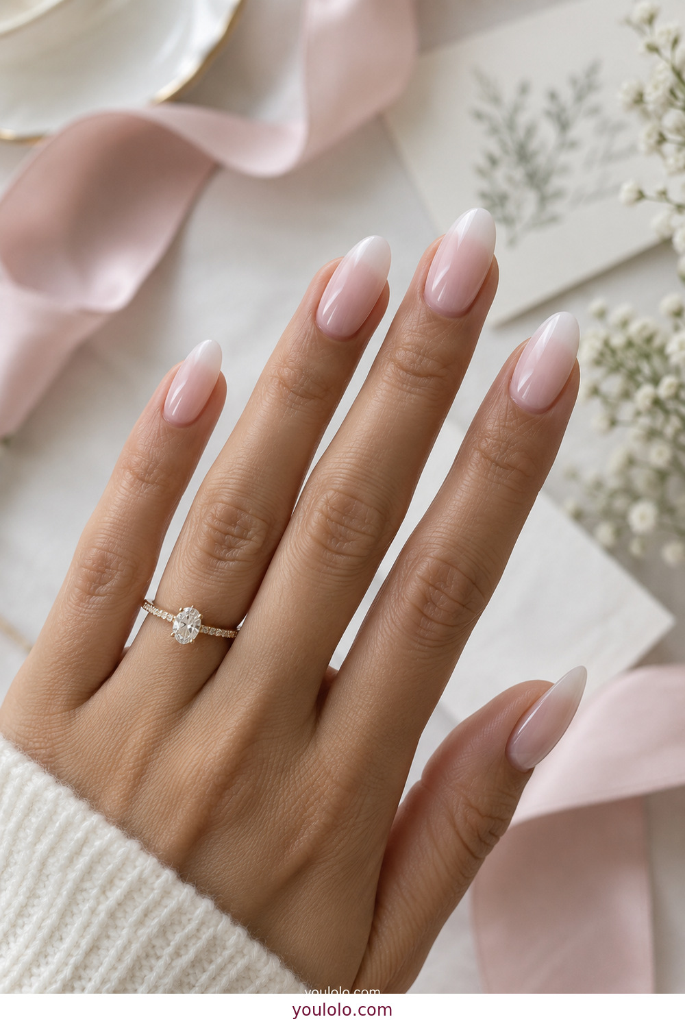 Soft baby boomer ombre with milky white almond tips
