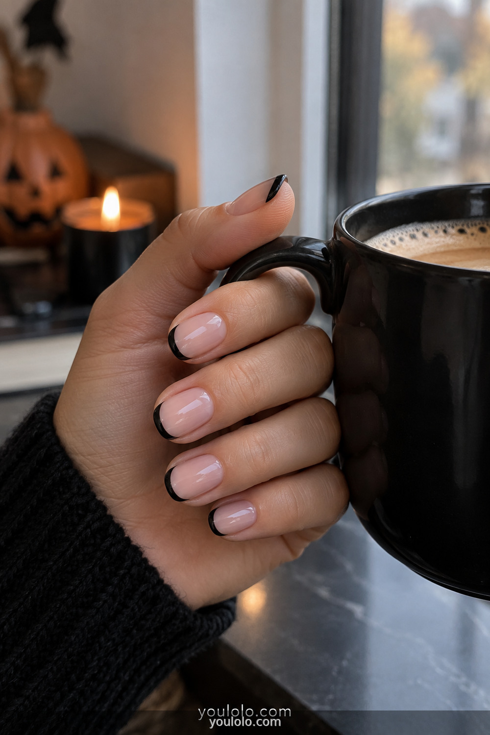 Sheer nude manicure with thin black micro French tips
