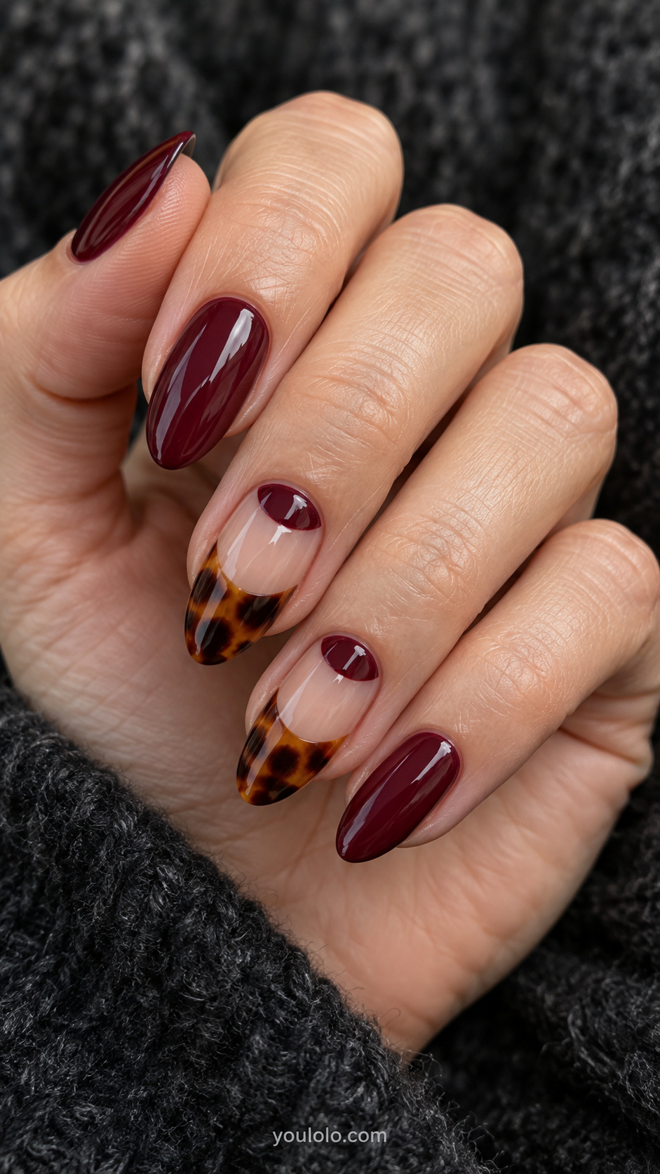 Burgundy half moons with amber tips manicure