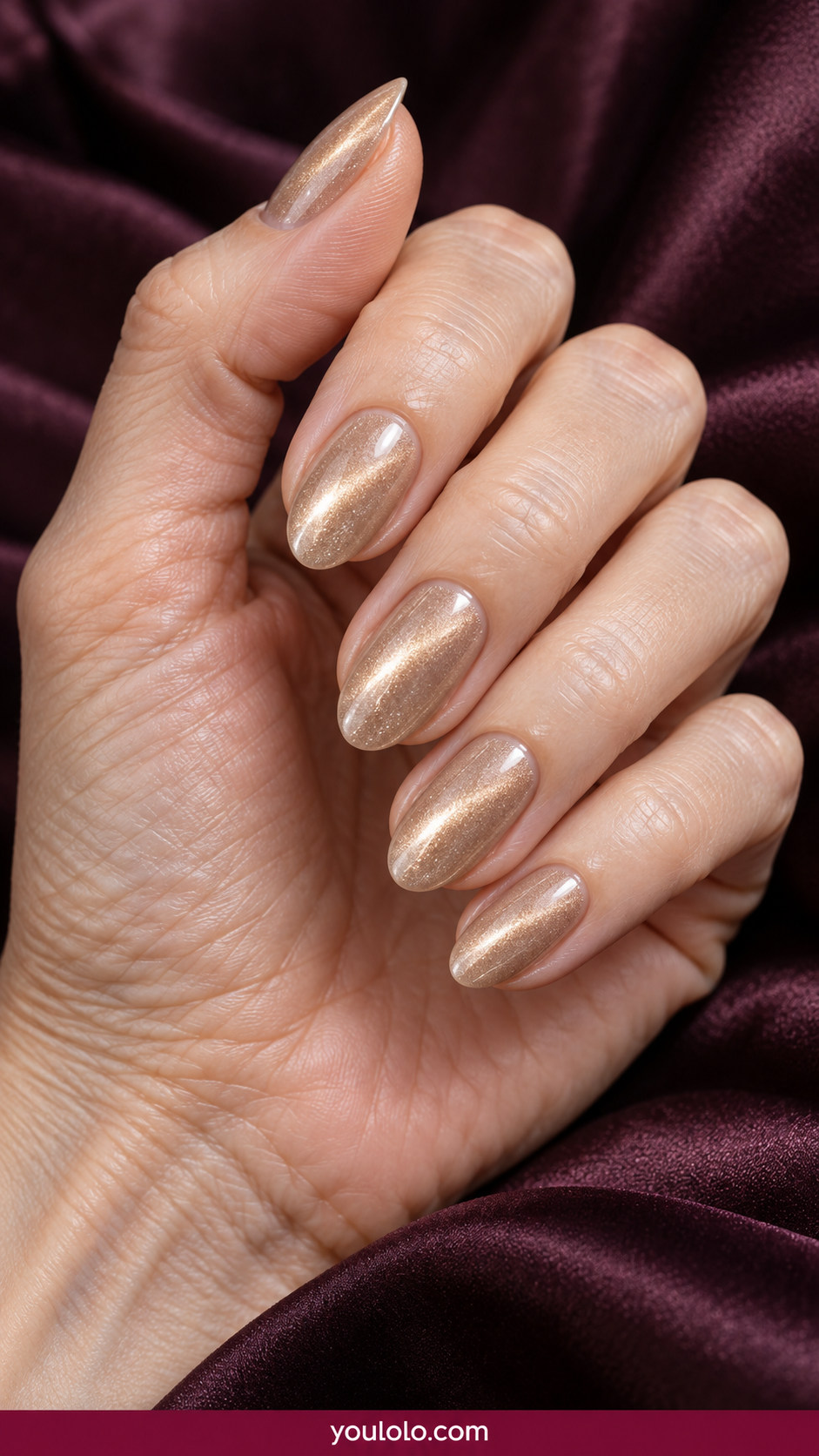 Cat Eye Nails idea 9: champagne beige magnetic cat-eye with understated pearl velvet glow on an anatomically realistic feminine hand