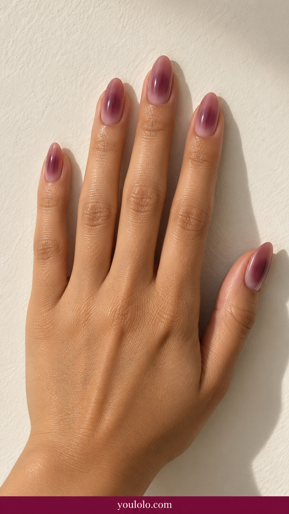 Aura Nails idea 9: dusty rose almond nails with gentle plum aura and blurred edges on an anatomically realistic feminine hand