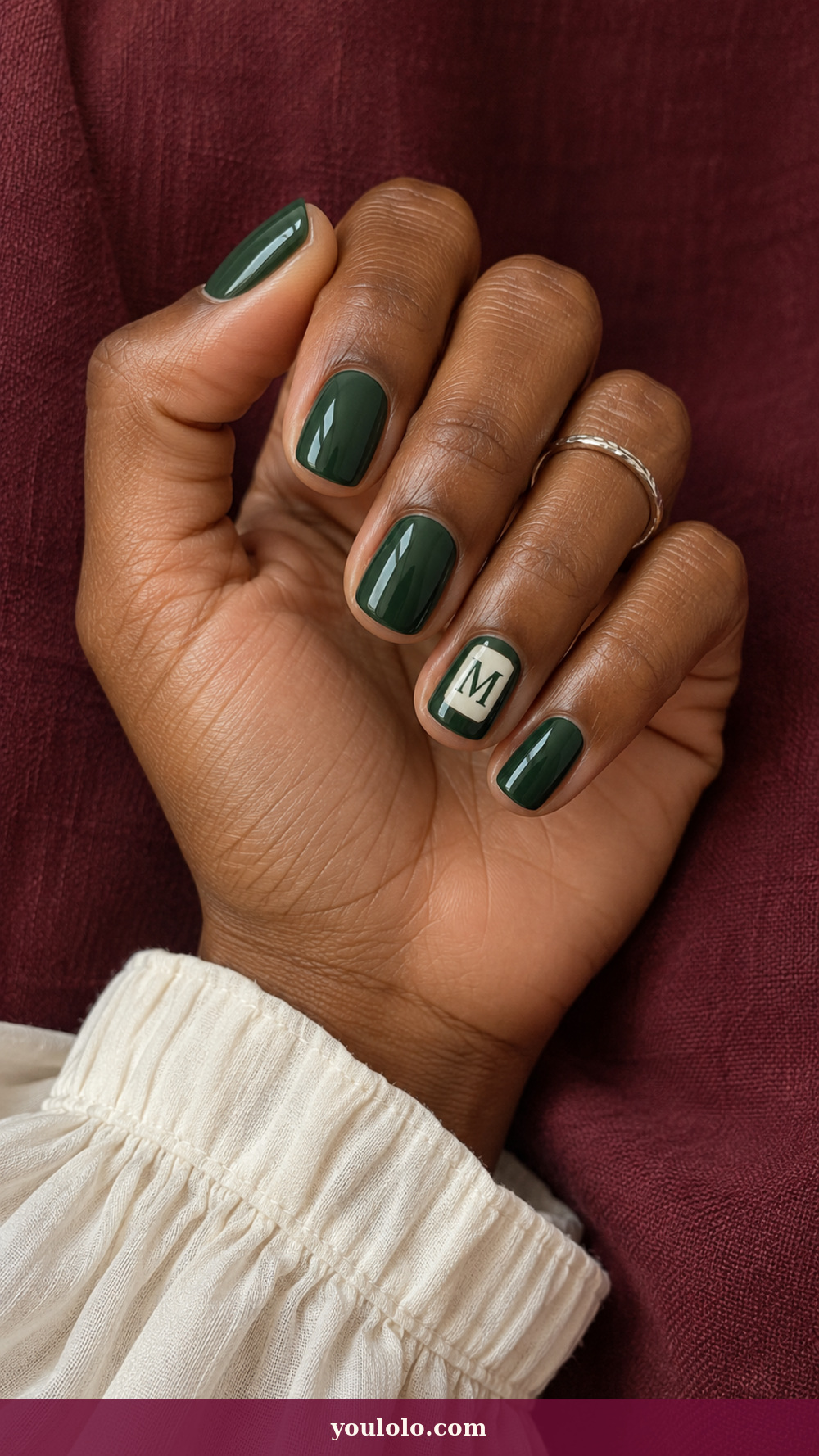 Initial Nails idea 9: Enamel Tile Letter on a realistic feminine hand
