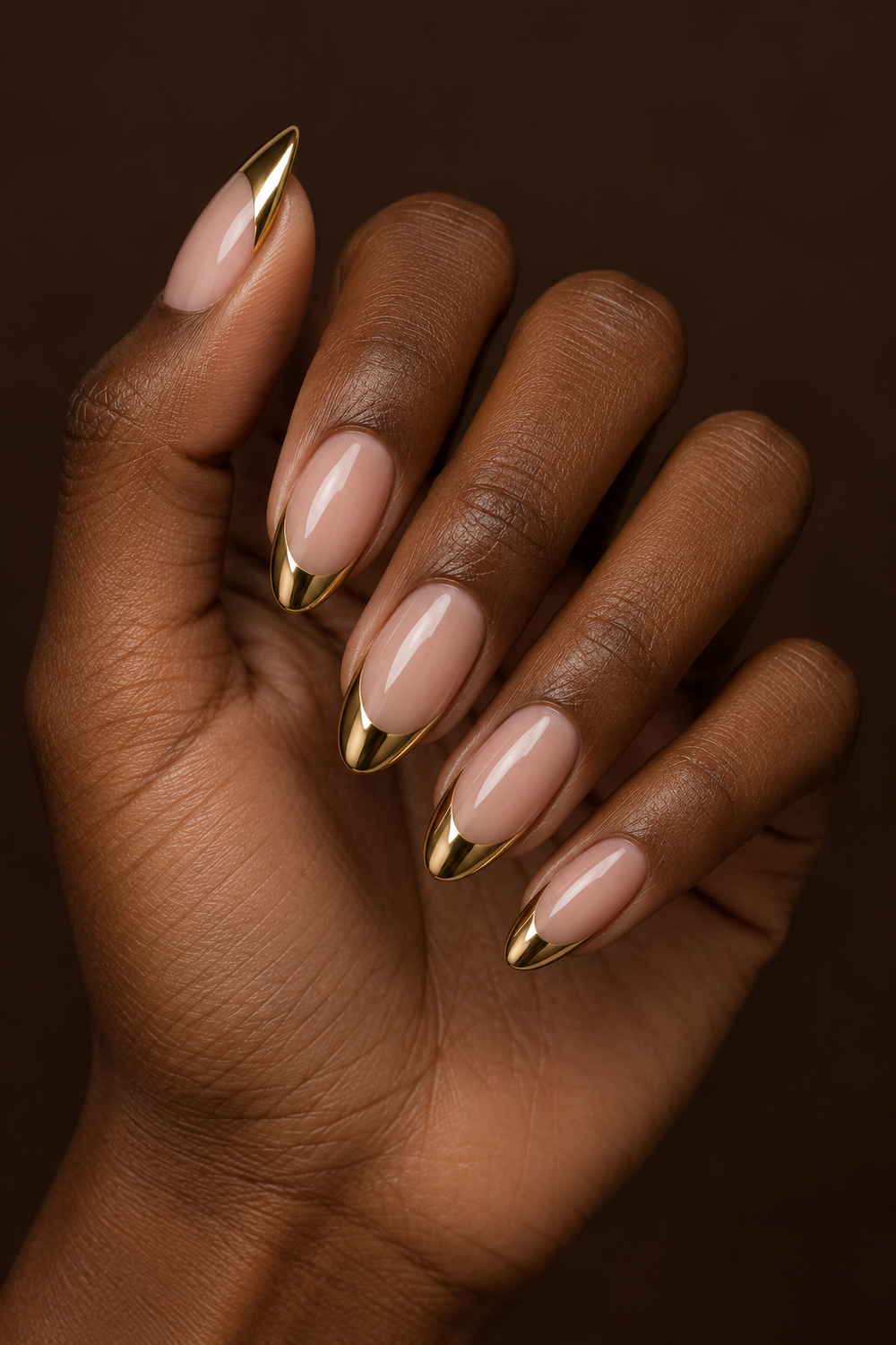Mirror gold chrome French tip nails on almond nails