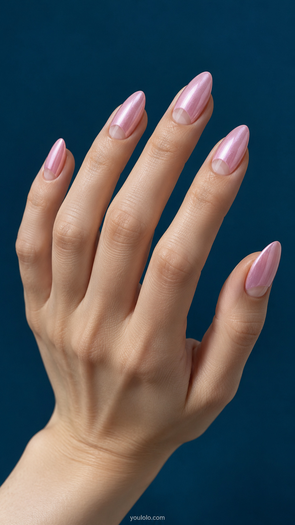Pearl-glazed pink with a negative-space crescent manicure