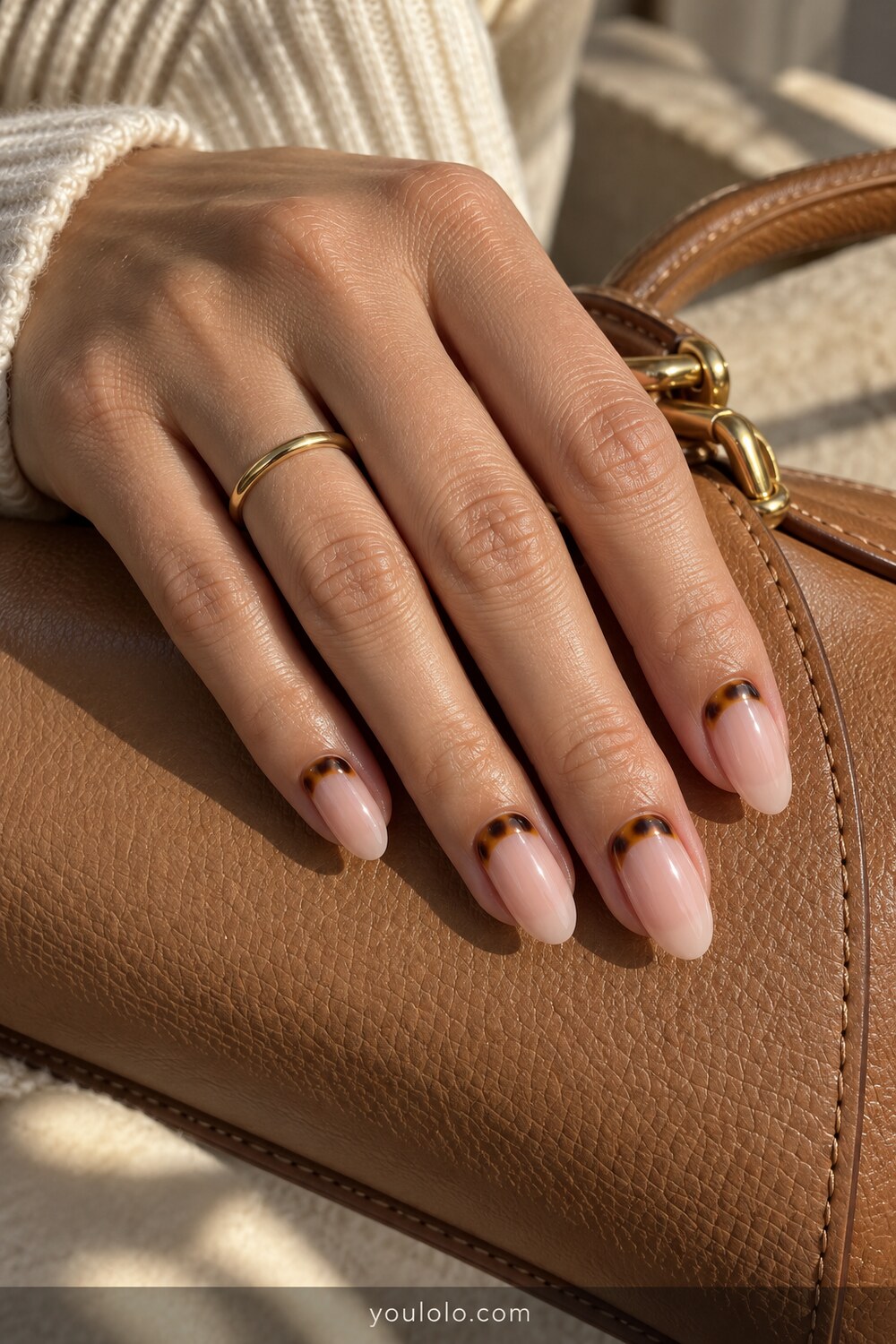 Tortoiseshell cuticle cuffs on sheer almond nails