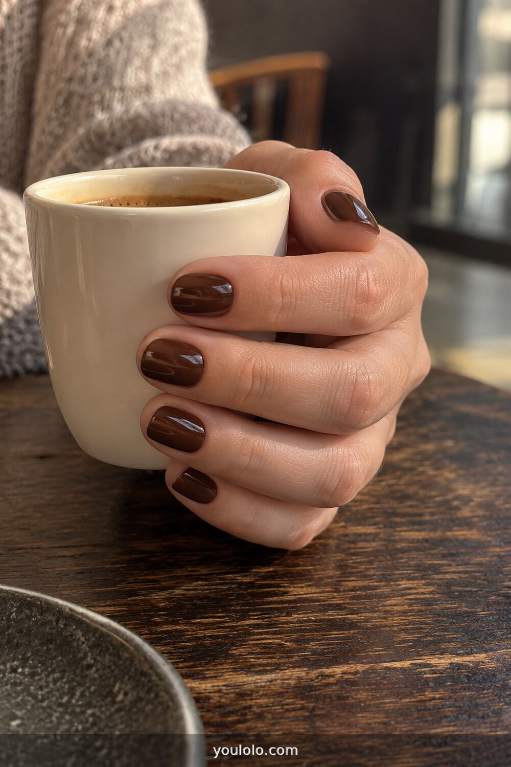 Chocolate brown glass manicure on short rounded nails