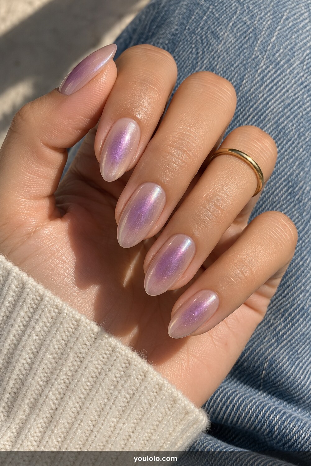 Purple aura chrome over a sheer nude almond base