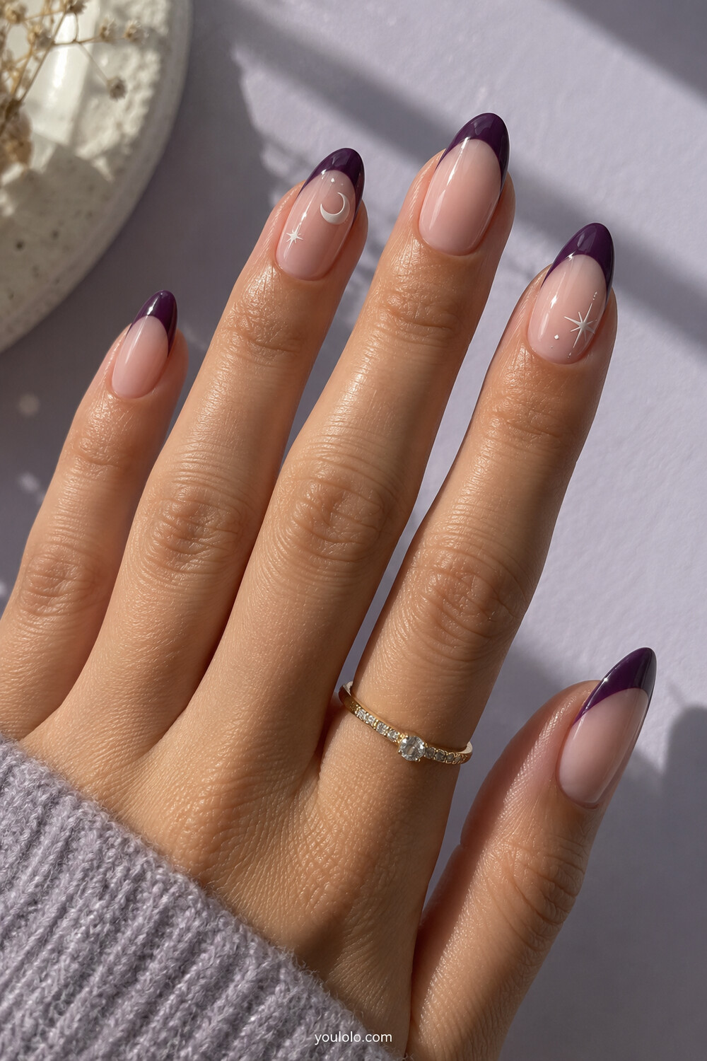 Purple curved French manicure with delicate crescent and star accents