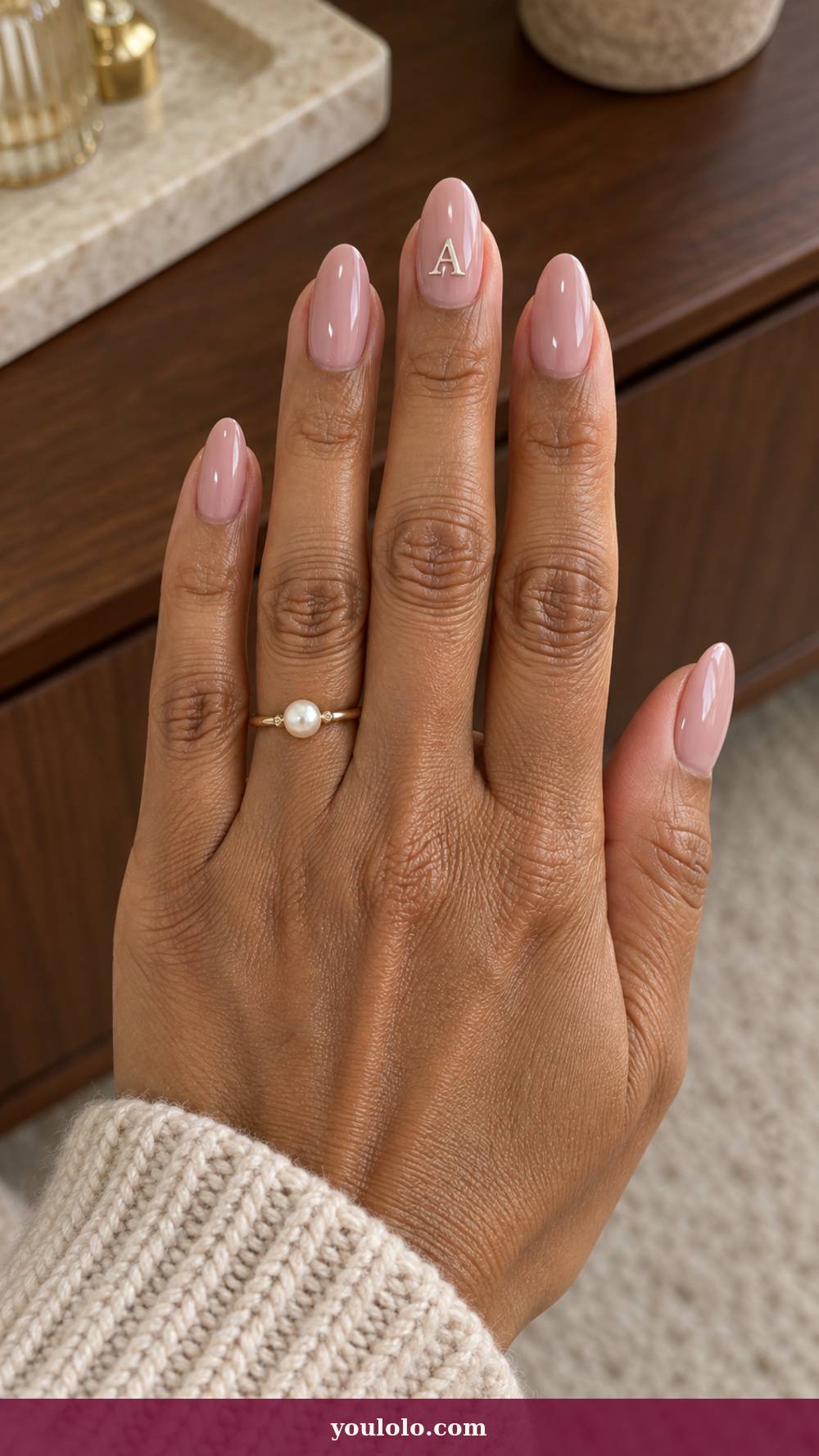 Initial Nails idea 10: Silver Letter Charm on a realistic feminine hand