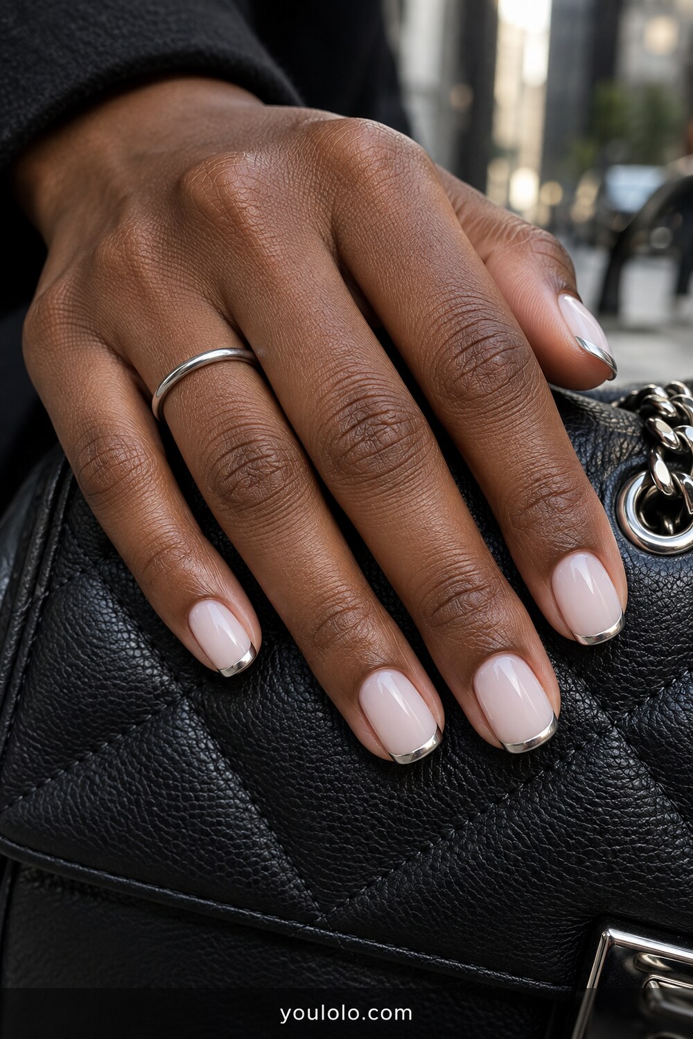 Silver micro chrome French tips over a milky base