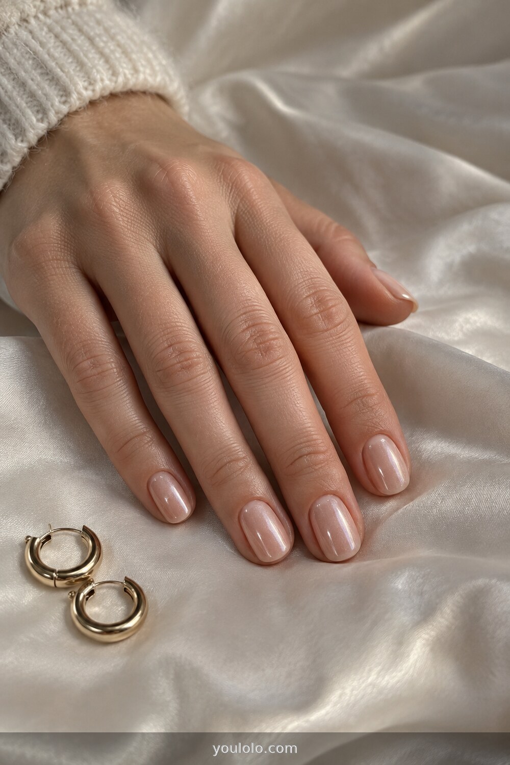 Champagne glazed nude manicure with subtle pearly shine