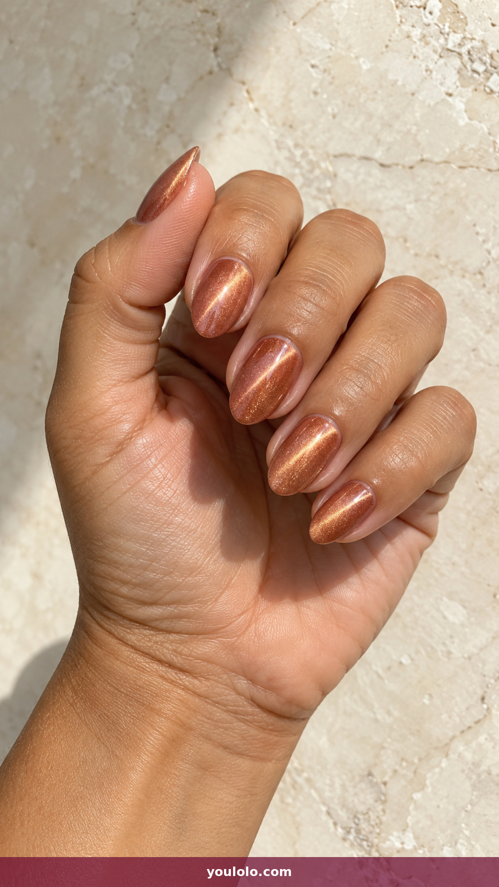 Peach Nails idea 11: Copper Peach Cat-Eye in a realistic fall manicure