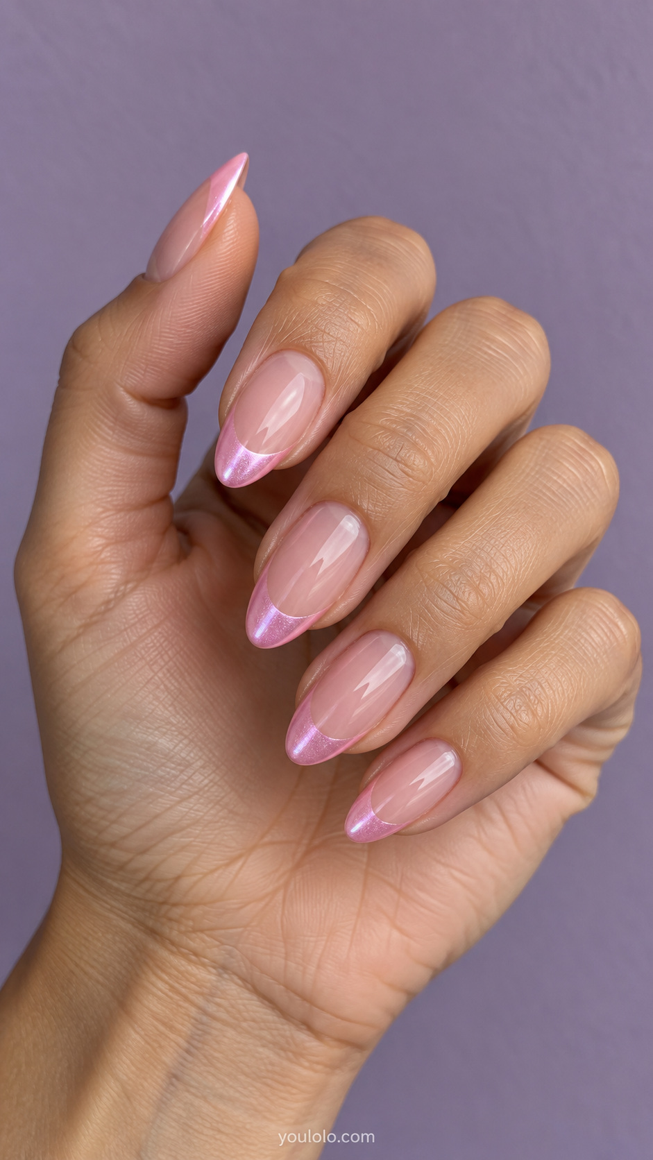 Glazed pink tips over a clear blush base manicure