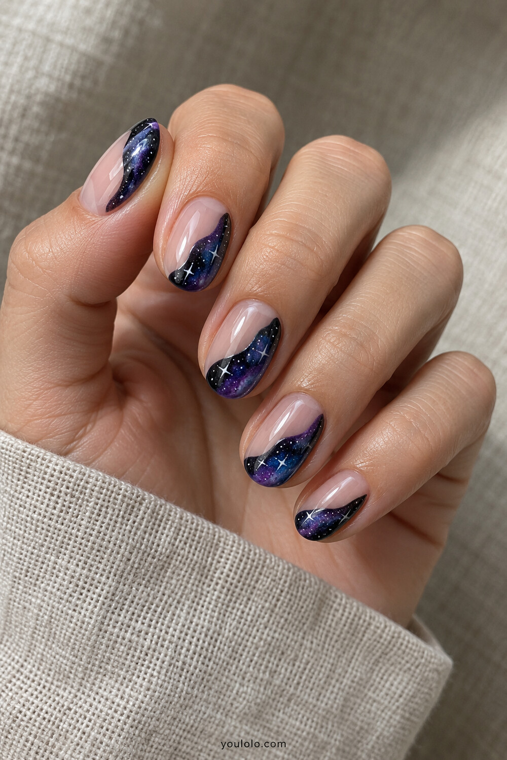 Negative space manicure with wavy black purple galaxy sections