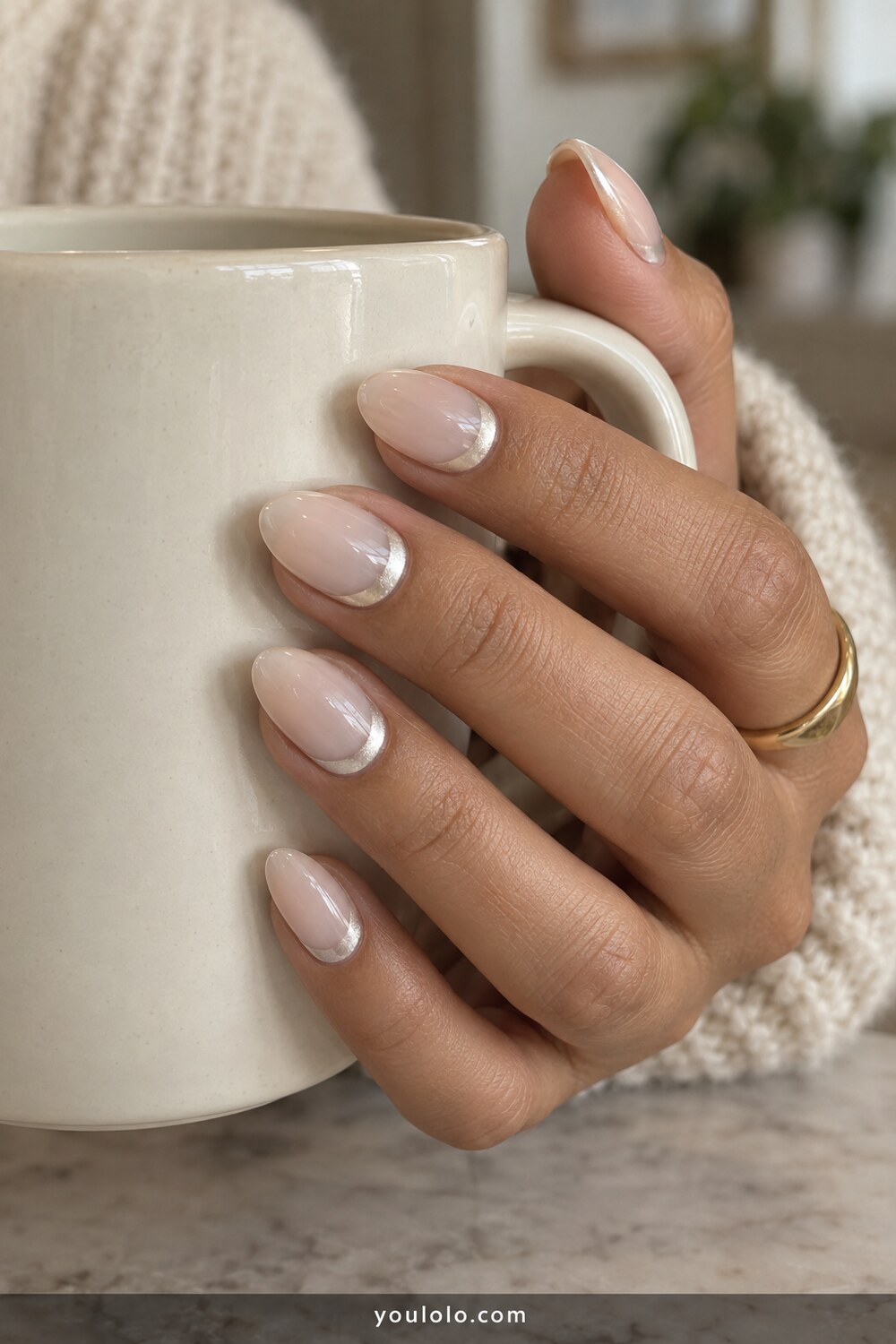 Pearl reverse French detail on milky white oval nails