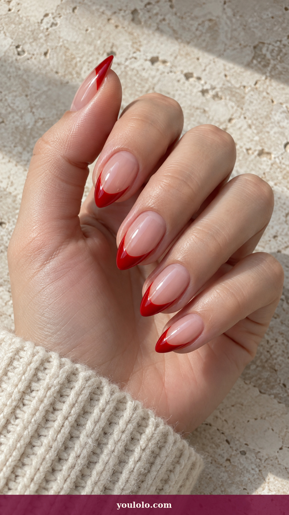 Short Stiletto Nails idea 11: Red Patent Drip Point on a realistic feminine hand