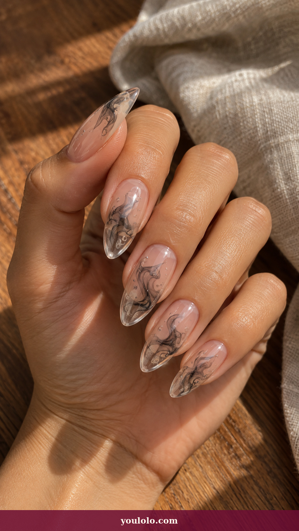 Acrylic Nails Ideas idea 11: Smoke Bubble Core on a realistic feminine hand