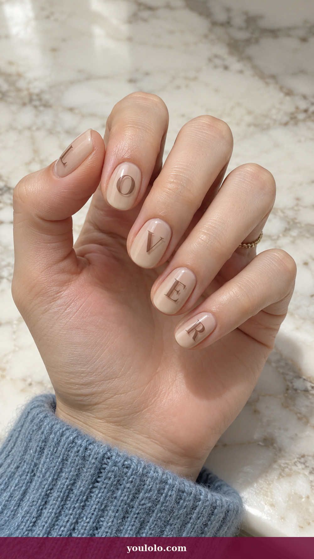 Initial Nails idea 11: Soft Shadow Initial on a realistic feminine hand