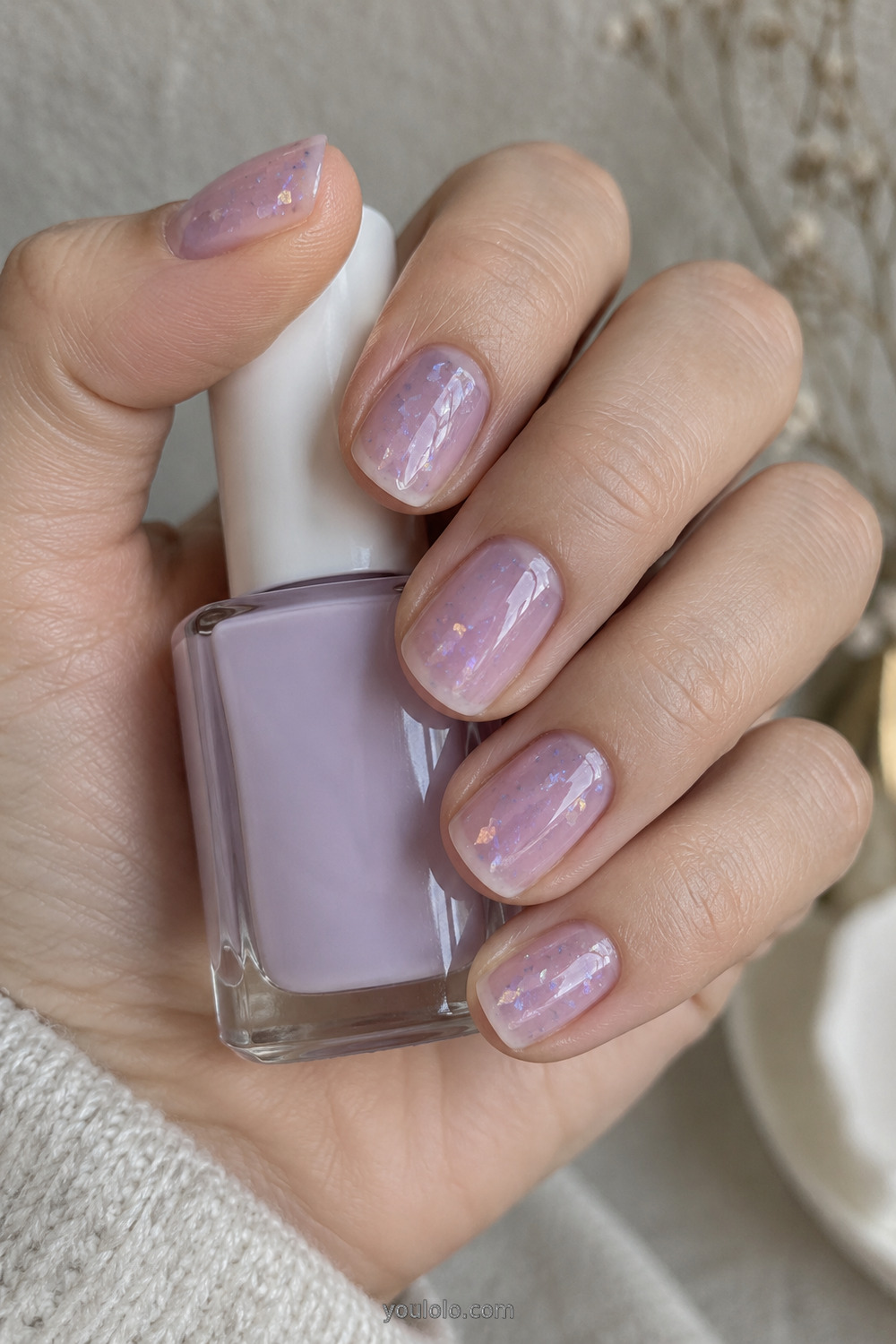 Short lavender jelly nails with encapsulated iridescent flakes