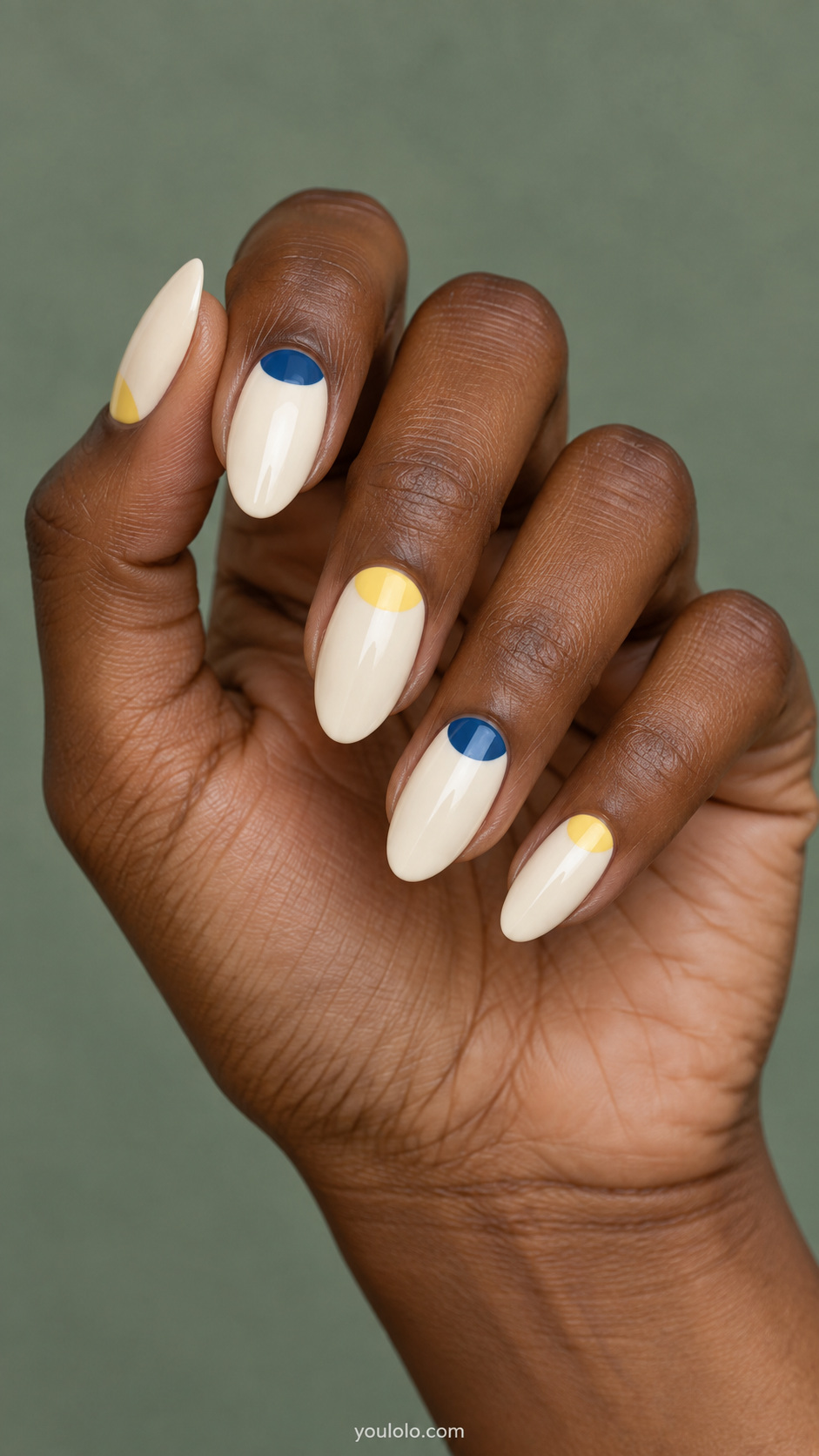 Alternating blue and yellow half moons manicure