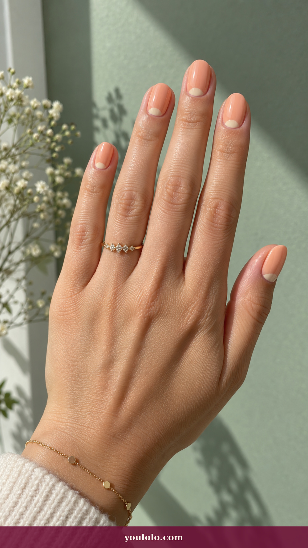 Simple Spring Nails idea 12: Apricot Half Moon on a realistic feminine hand