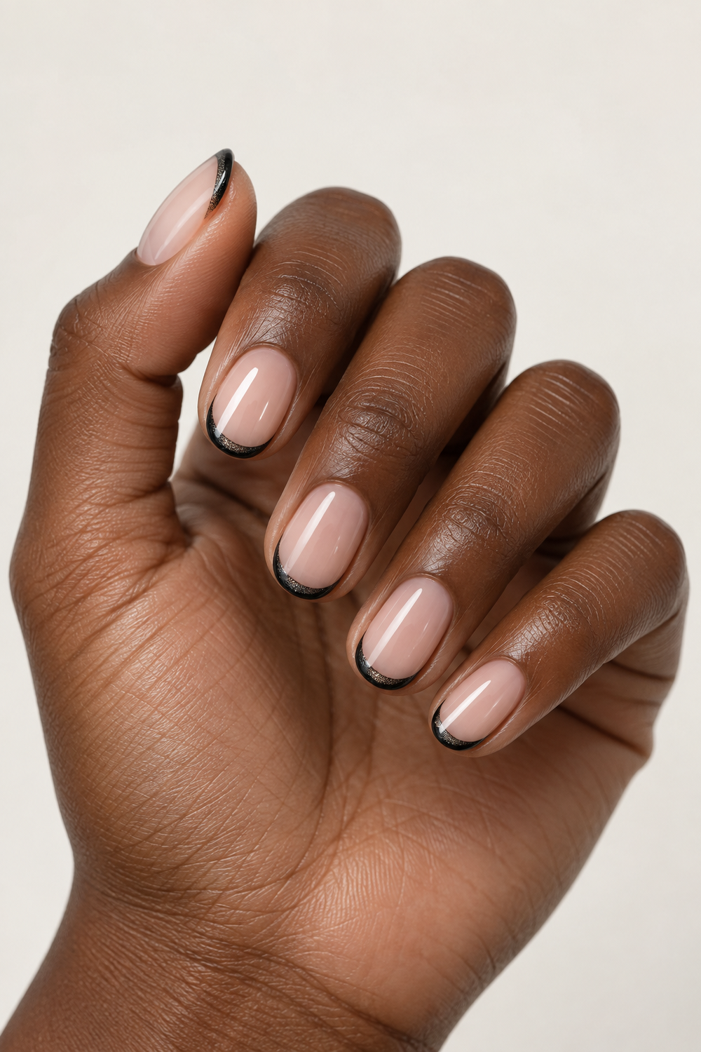 Black cat eye micro French manicure on short oval nails