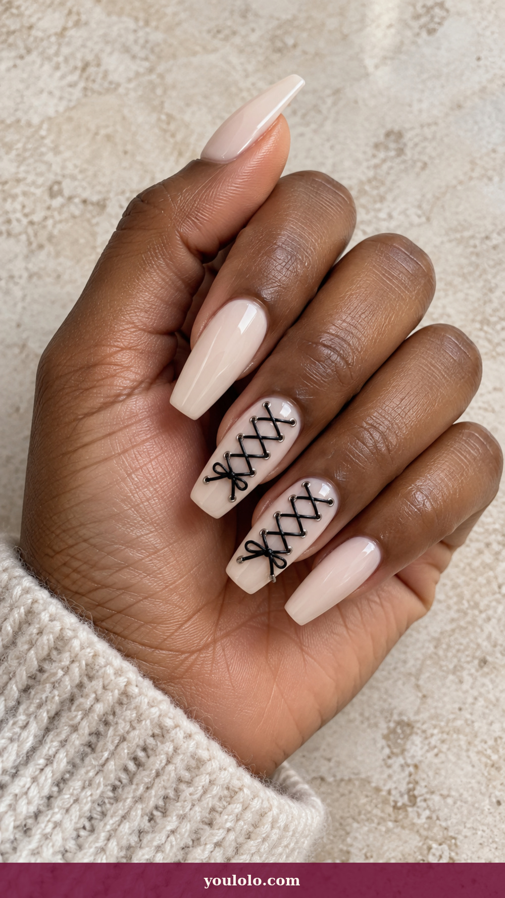Acrylic Nails Ideas idea 12: Ivory Corset Lacing on a realistic feminine hand
