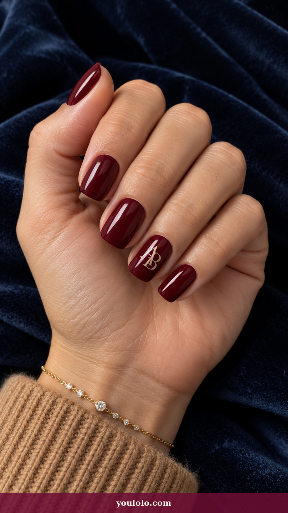 Initial Nails idea 12: Linked Double Monogram on a realistic feminine hand