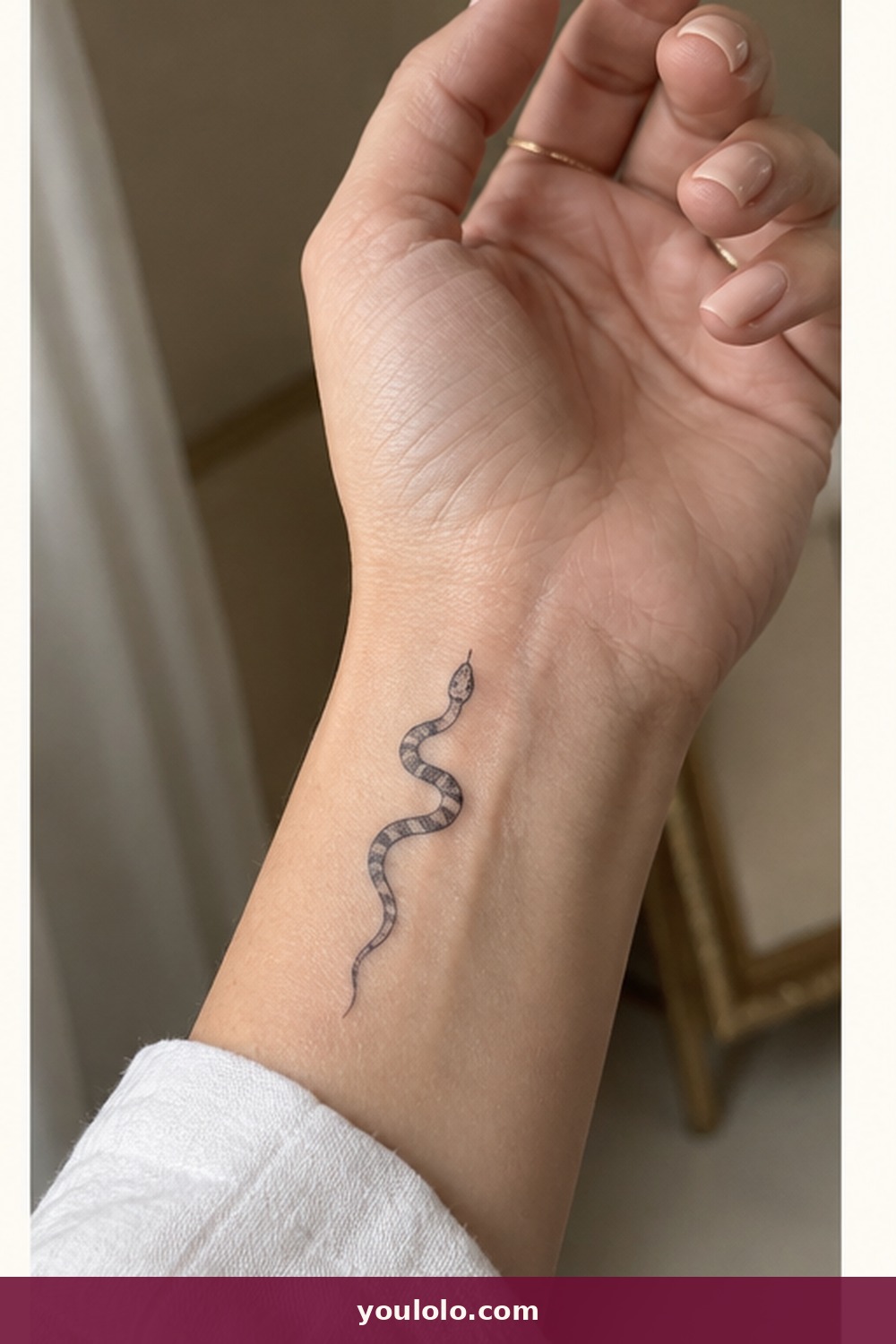 Miniature Curved Snake — idea 12 from Dainty Wrist Tattoos for Women
