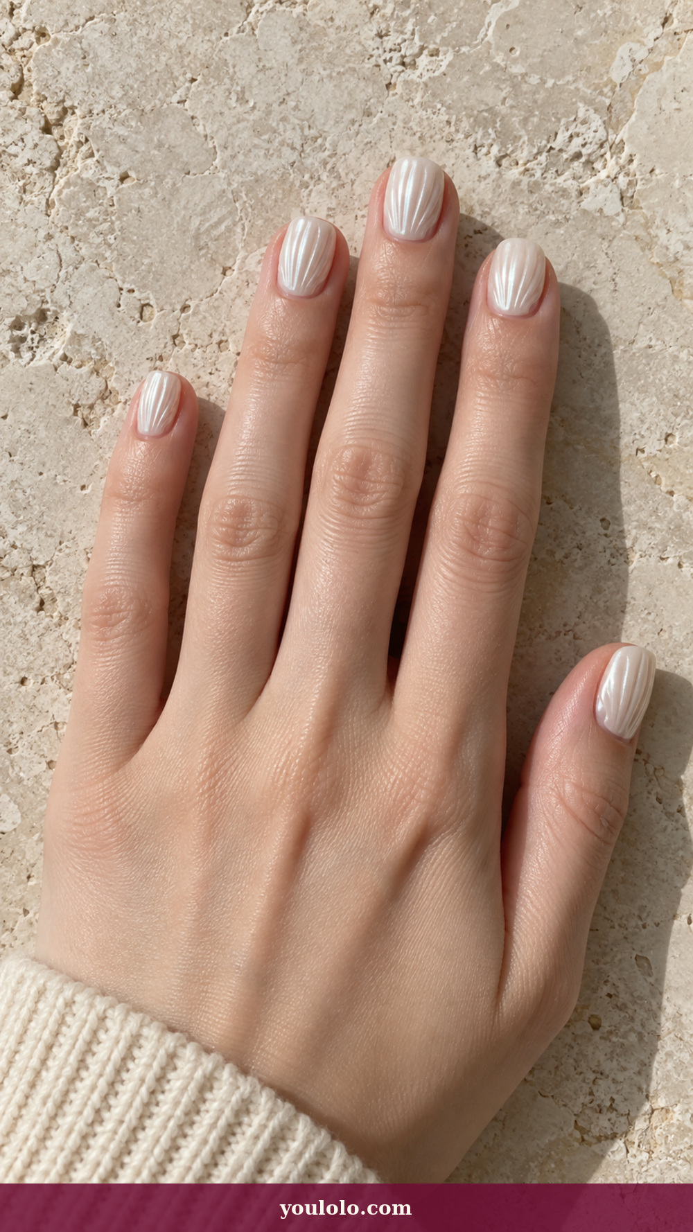 Princess Nails idea 12: Pearl White Shell Ridges on a realistic feminine hand