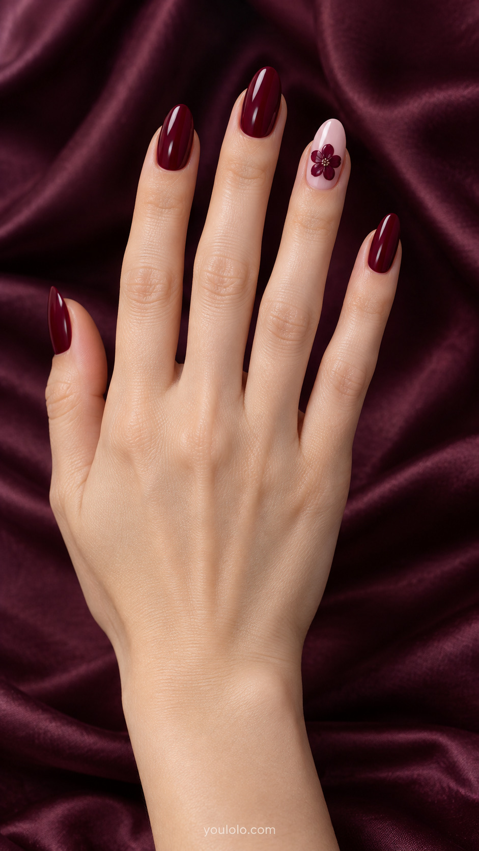 Sculpted Single Flower — Medium almond nails; glossy burgundy solids, pale pink ring with one low-profile raised burgundy five-petal flower.