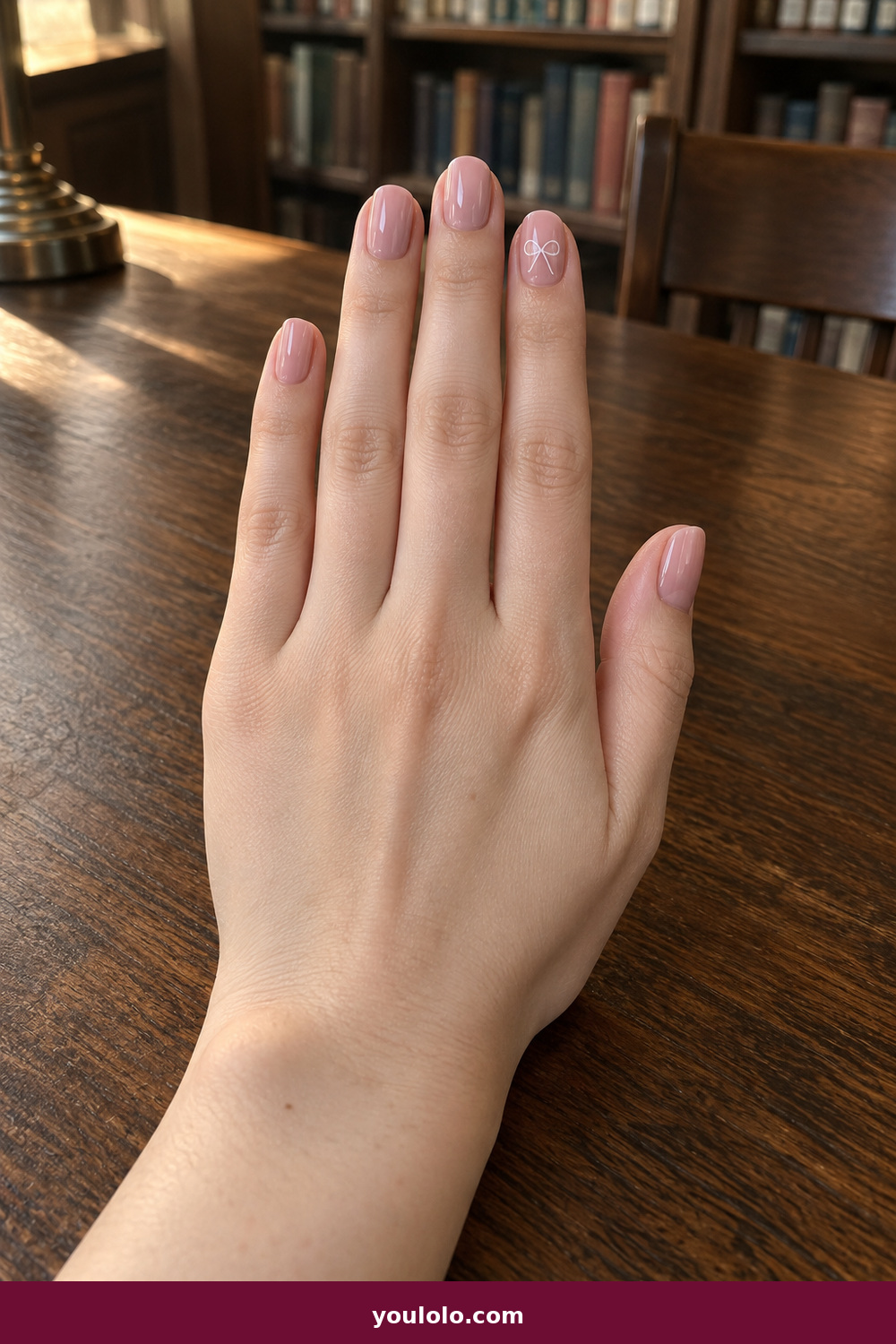 Pink and White Nails idea 12: White Bow Micro Accent, short blush nails with one tiny white line-art bow accent