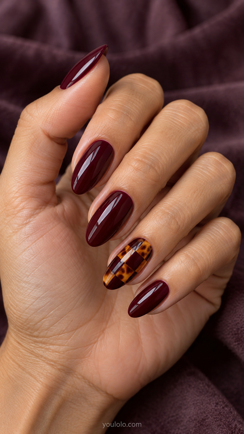 Wine and amber checkerboard accent manicure