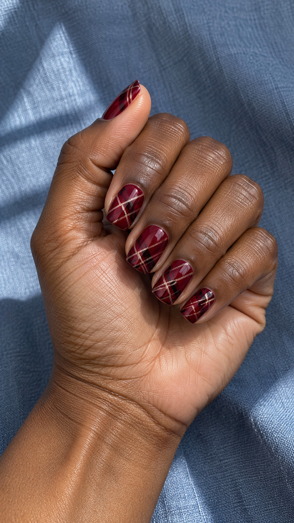 Plaid Nails idea 12: Wine Diagonal Tartan manicure on a realistic feminine hand