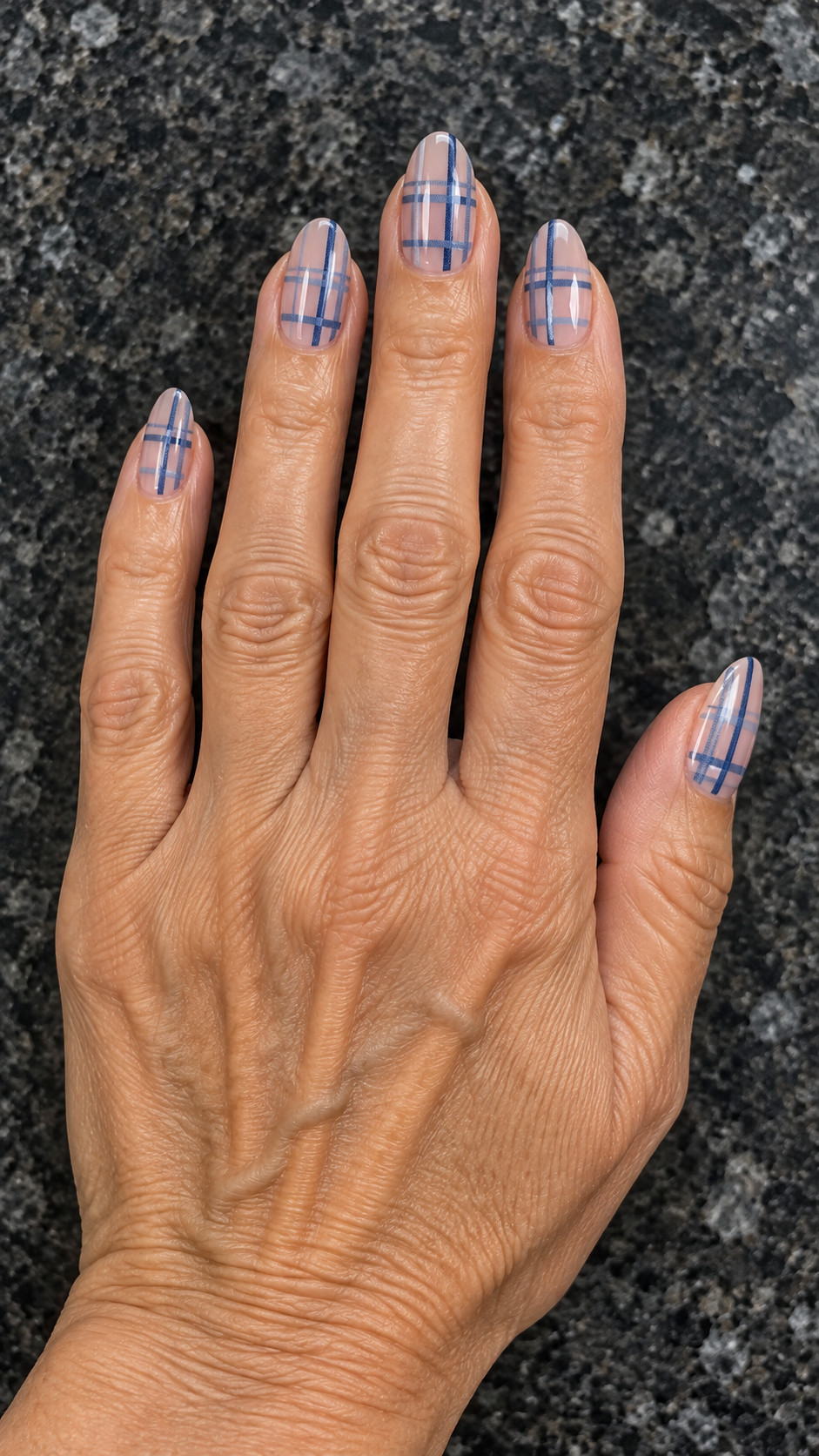 Plaid Nails idea 13: Blue Grid on Sheer Base manicure on a realistic feminine hand
