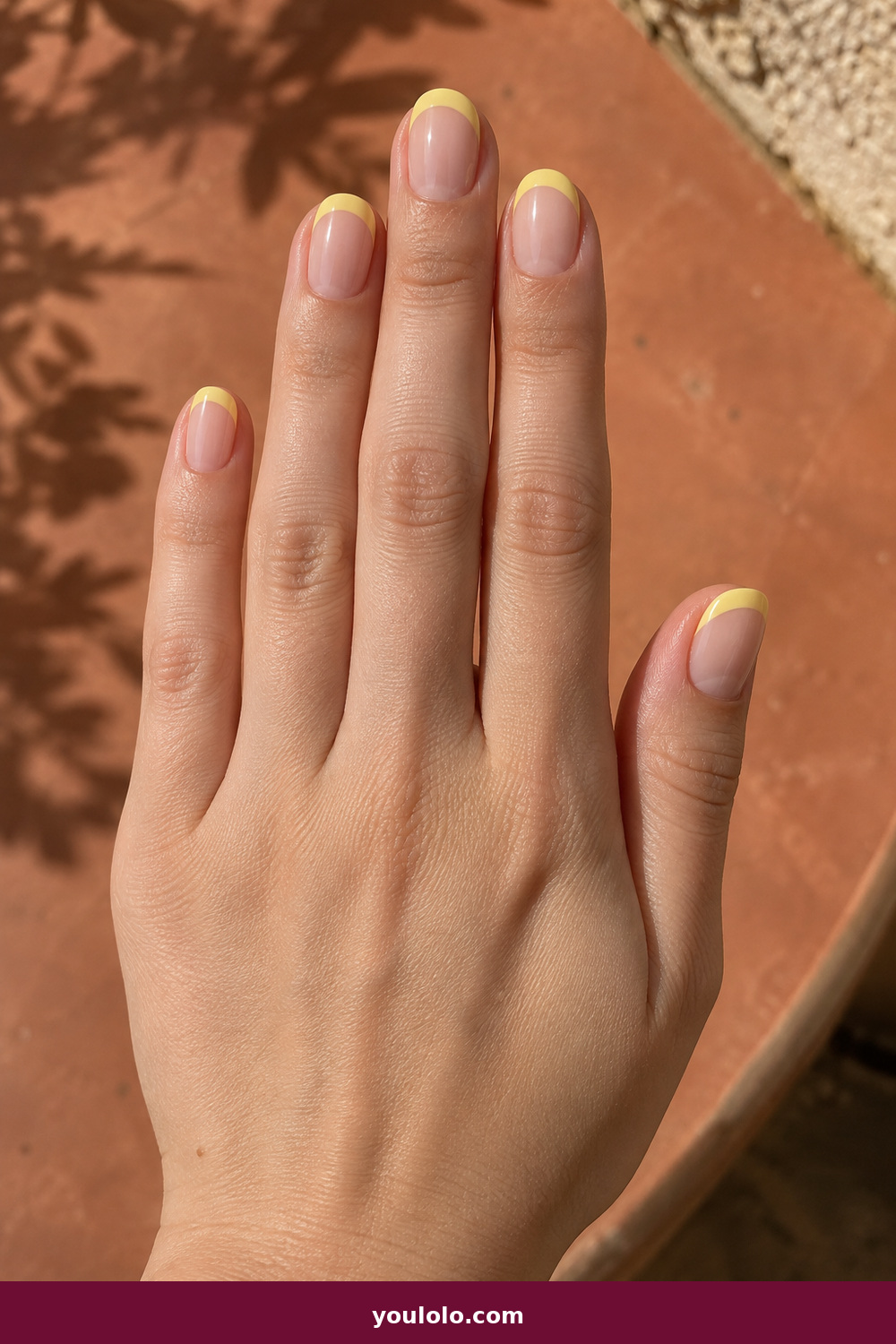 Gel Nails Ideas idea 13: Butter Yellow French, short nude gel nails with smooth butter-yellow rounded tips
