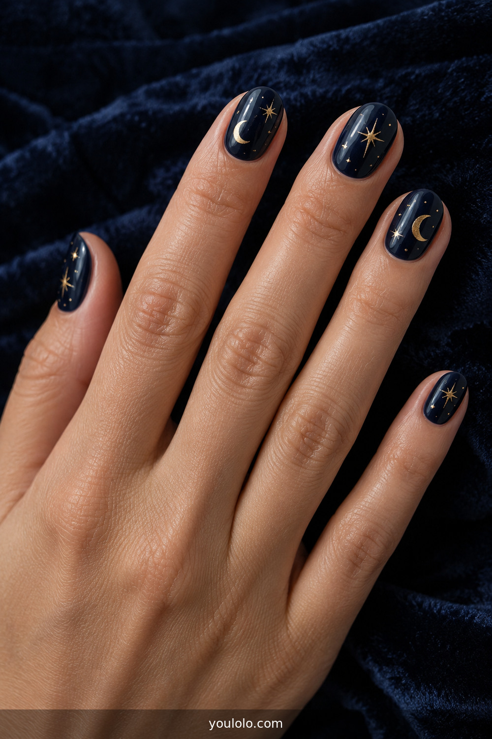 Midnight navy nails with tiny gold celestial details