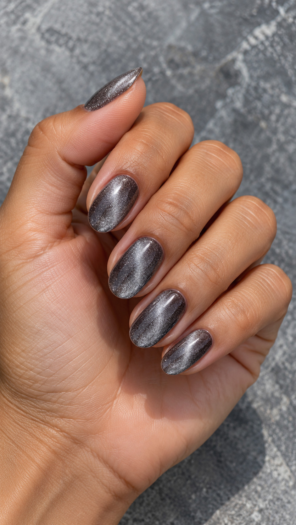 Velvet Nails idea 13: Charcoal Silver manicure on a realistic feminine hand