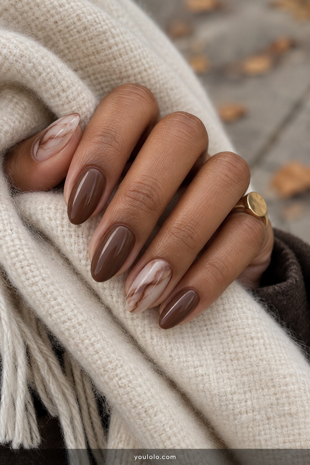 Chocolate marble accent design on almond nails