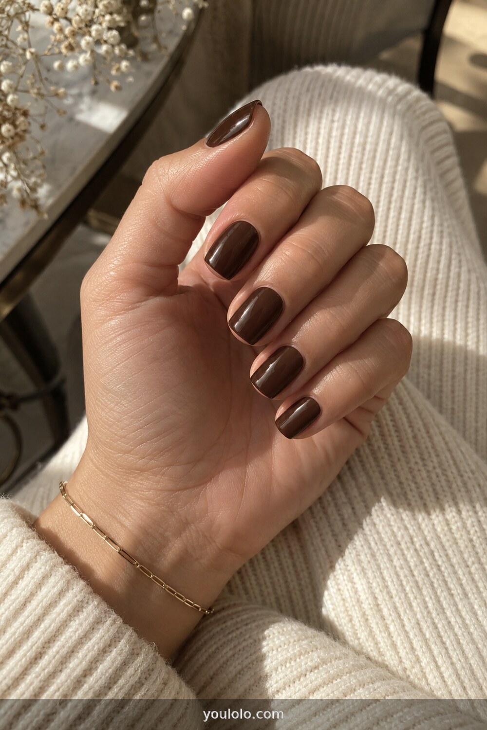Deep espresso brown polish on medium square nails