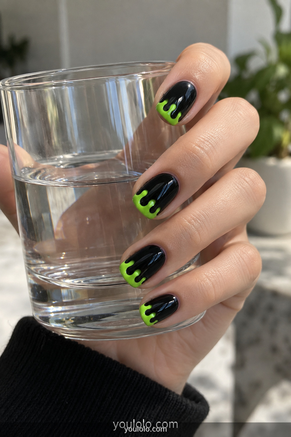 Black nails with simple bright green slime tips
