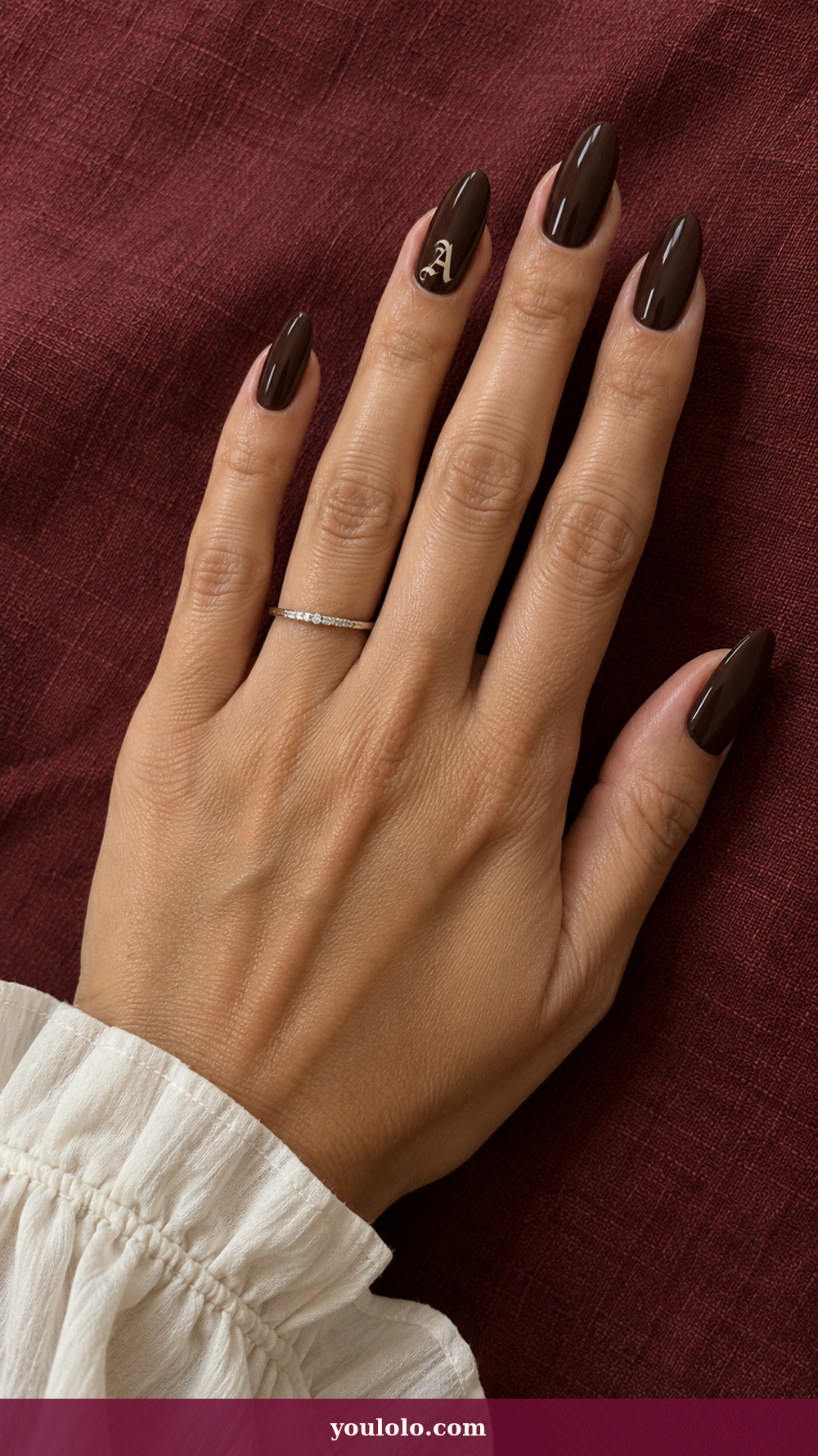 Initial Nails idea 13: Ivory Old-English Letter on a realistic feminine hand
