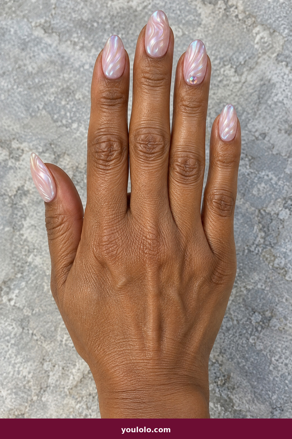Pink Nails with Rhinestones on One Finger Ideas: Pink Oyster Shell Jewel, Pearlescent almond nails with pink-and-white oyster-shell ridges and one opalescent crystal on the ring finger.