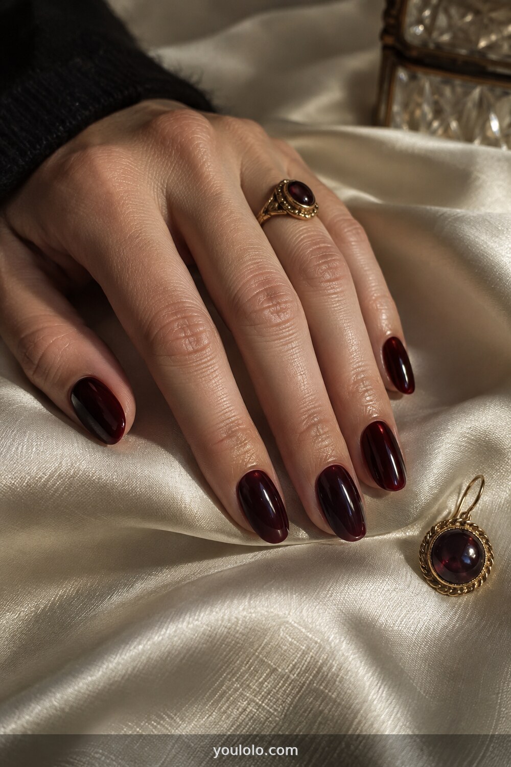 Black cherry glossy polish on oval nails